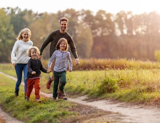 Family taking an outdoor walk together.